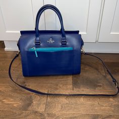 Like New! Kate Spade Purse. Cobalt Blue And Turquoise With Gold Hardware. Front Pocket And Front Zipper Section As Well. Perfect For Phone, Keys And Other Items That You Need Frequent Access Too. Spacious And Clean Interior. Small Zipper Compartment Inside And 2 Pockets. Removeable Crossbody Strap Included As Well. Perfect Spring/Summer Bag. Will Add A Pop Of Color To Any Outfit! Paid $425 From Kate Spade. Approximately 12.5 Inches Wide And 9 Inches Tall. Summer Bag, Kate Spade Purse, Kate Spade Bag, Crossbody Strap, Cobalt Blue, Gold Hardware, Front Zipper, Front Pocket, Cobalt