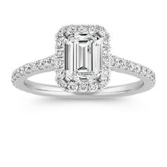 an emerald cut diamond engagement ring with pave set shoulders