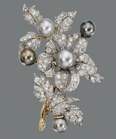 CULTURED PEARL AND DIAMOND BROOCH The floral spray set with 125 round diamonds weighing approximately 5.00 carats and accented with 5 cultured pearls in pale to medium gray, measuring approximately 8.4 to 10.7 mm., mounted in white and yellow gold. #diamondbrooch Art Deco Jewellery, Bijoux Art Nouveau, Floral Spray, Diamond Brooch, Pearl Brooch, Fabulous Jewelry, Vintage Jewels, Lovely Jewellery, Dream Jewelry