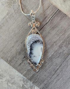 "Stunning Dendric Opal Inverted Teardrop Stone Pendant Set In A Gorgeous Sterling Silver Setting On An 18\" Sterling Silver Chain. 3\" H x 1\" W. Handmade - Shipped From Saint Louis, MO." Unique Nickel-free Necklace With Teardrop Pendant, Wire Wrapped Teardrop Pendant Necklace, Spiritual Nickel-free Teardrop Necklace, White Teardrop Necklace With Large Pendant, Unique Nickel-free White Necklace, Unique White Nickel-free Necklace, Spiritual Nickel-free Teardrop Pendant Necklace, Spiritual Teardrop Necklace With Large Pendant, Spiritual Teardrop Necklaces With Large Pendant