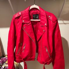 This Is A Brand New Faux Leather Jacket. Never Worn, A Nice Bright Red, With Tags Still On. Features: Belted, Water Resistant Closure Type: Zipper Fit: Classic Fit Pockets: 3 Front Zip Pockets Sleeve Length: Long Sleeve Warmth Factor: Midweight Apparel Length: 19 Inches Outerwear Length: Mid Fiber Content: 84.7% Viscose, 15.3% Polyester Fabric Description: Polyurethane Coated Filling Content: 100% Polyester Lining Material: Polyester Coat Style: Motorcycle Jackets Collar: Point Collar Care: Mach Red Biker Outerwear For Fall, Trendy Levi's Long Sleeve Leather Jacket, Levi's Trendy Long Sleeve Biker Jacket, Trendy Levi's Leather Jacket, Trendy Levi's Long Sleeve Biker Jacket, Levi's Long Sleeve Leather Jacket For Spring, Levi's Spring Biker Outerwear, Levi's Trendy Biker Jacket For Spring, Levi's Trendy Spring Biker Jacket