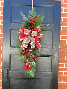 a christmas wreath hanging on the front door