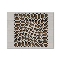 the laser cutout is made from wood and has an intricate design on it's surface