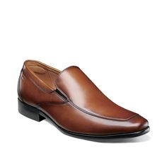 Florsheim-Postino Moc Toe Loafer Stand out with the Postino Moc Toe loafer from Florsheim. These slip-ons are fashioned with a textured leather upper and rubber sole for extra traction. Formal Leather Slip-ons For Fall, Brown Moc Toe Slip-ons For Fall, Business Casual Slip-ons With Almond Toe And Stitched Sole, Semi-formal Slip-on Oxfords With Textured Sole, Classic Closed Toe Slip-ons With Textured Sole, Semi-formal Slip-on Loafers With Stitched Sole, Classic Slip-ons With Textured Sole And Moc Toe, Formal Plain Toe Slip-ons For Fall, Business Slip-on Moccasins For Fall