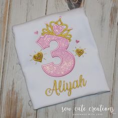 This personalized princess birthday shirt is perfect for your next princess birthday outfit.  This princess crown party shirt features the birthday number of  you choice along with this cute crown and hearts in your choice of colors and fabrics.  It is perfect for your Princess Birthday Party, every day Princess Shirt. Your little girl will love this cute Princess birthday shirt design.   It can be done with the birthday number of your choice.  Custom made and personalized with your child's name in the font of your choice, it is the perfect addition to your Princess party outfit.  In can be done in the pink and gold princess colors from the main photo or all fabrics and colors can be changed.  Available fabrics:  http://www.flickr.com/photos/sewcutecreationsdesigns/sets/72157626412392703/ Princess Party Outfit, Princess Birthday Outfit, Birthday Shirt Design, Princess Birthday Shirt, Birthday Glitter, Crown Party, Princess Shirt, Princess Coloring, Cute Princess