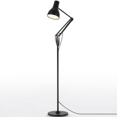 a black floor lamp on a white background with a cord attached to the base and an arm