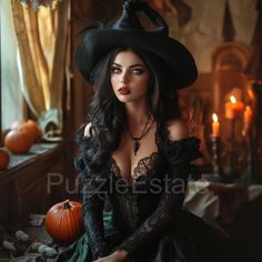 a woman in a witch costume sitting on a bed next to pumpkins and candles