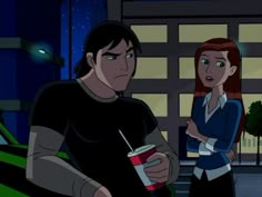 the young man and woman are talking to each other in front of a building at night