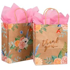 two brown paper bags with pink flowers on them