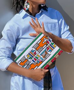 Our African Print Mid-Size Clutch purse is the perfect addition to your wardrobe. Made of authentic Ankara by artisans in Ghana, these clutches are truly one of a kind. Each one features a different fabric and flap closure that adds a little bit of elevated style to the look of your Ankara clutch. Artisan Multicolor Clutch As A Gift, Artisan Multicolor Rectangular Clutch, Multicolor Clutch For Daily Use, Casual Multicolor Rectangular Clutch, Casual Rectangular Clutch For Gift, Vegan Leather Backpack, Slouch Bags, Yoga Mat Bag, Elevated Style