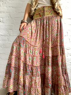 "This is gorgeous long boho style skirt perfect for ocassions, parties and everyday loose and flowy with oryginal, traditional wide banjara embroidered belt can be worn as a strapless sundress with open back also during maternity ❣️ MEAESURE elasticated waist 30-40 \" length 40\" MATERIAL *silk *poliester *no lining CARE INSTRUCTIONS * Wash in warm water * Hand wash recommended * Hang to dry IMPORTANT NOTE * Please note that colour shown on your monitor may vary from the colour of the fabric, du Tiered Floral Print Flowy Maxi Skirt, Flowy Ruffled Maxi Skirt For Vacation, Tiered Flowy Floral Maxi Skirt, Tiered Floral Print Maxi Skirt, Flowy Tiered Bottoms For Beach, Flowy Tiered Beach Bottoms, Maxi Length Ruffled Skirt For Vacation, Maxi Skirt With Ruffles For Vacation, Bohemian Floral Print Skirt For Summer