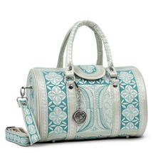 Our stunning cross-body bag is ready to have you turning heads. The intricate embroidery, featuring traditional Indonesian designs lends to its beauty, while its generous size makes for a gorgeous everyday handbag. The Nano Bag is not only beautiful, but it's 100% cruelty-free. Whether you are vegan or looking for ethical and artisanal-made, the Nano Bag is a top choice for the conscious consumer. 
      Snap button closure on the exterior front.  Three pockets including one zippered in the cott Indonesian Design, Banda Bags, Perfect Travel Bag, Everyday Handbag, Barrel Bag, Handcrafted Bags, Functional Fashion, Vegan Bags, Conscious Consumer