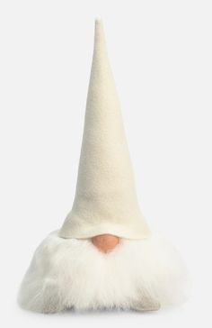 a white gnome's hat on top of a white surface with an orange nose