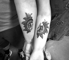 two people with matching tattoos on their arms