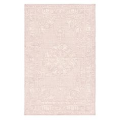 a pink rug with an ornate design on the front and back side, in shades of beige