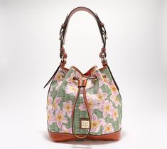 Covered in a fresh, floral design, this coated cotton drawstring bag feels just right for spring. Sling it over your shoulder as you step out into the sunshine -- an adjustable handle allows for comfortable positioning. From Dooney & Bourke. Casual Multicolor Bucket Bag For Spring, Green Bucket Bag For Daily Use In Spring, Spring Green Bucket Bag With Adjustable Strap, Green Bucket Bag With Adjustable Strap For Spring, Green Bucket Bag For Everyday Spring Use, Spring Multicolor Bucket Bag, Multicolor Bucket Bag For Spring, Multicolor Spring Bucket Bag, Spring Floral Print Bags