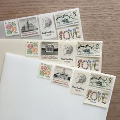 five stamps on top of an envelope with the washington monument in the center and flowers all over them