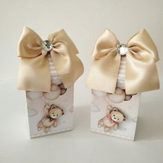 two small boxes with bows and teddy bears on them