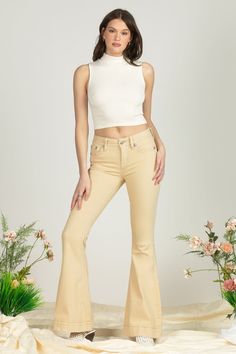 Beige, mid-rise flared jeans- Embroidered leather appliqué horseshoe design- Rhinestone rivet accents- Embossed beige leather cross Miss Me brand patch- Front Rise: 9"; Back Rise: 14"- Inseam: 34"  Model is wearing size: 25 Model Measurements: Height: 5'9" Bust: 34"Waist: 26" Hips: 37" Fabric Content: 99% Cotton, 1% ElastaneCare: Machine wash inside out in cold water with like colors. Dry flat Style No. M9160F-BEIGE Horseshoe Design, Super Flare Jeans, The Flare, Mid Rise Flare Jeans, Jeans Collection, Embroidered Leather, Cropped Flare Jeans, Body Dress, Cropped Flares