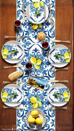 the table is set with blue and white plates