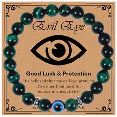 an evil eye bracelet with green agate beads and black onyxite beads, says good luck & protection it's beloved that the evil eye protects energy