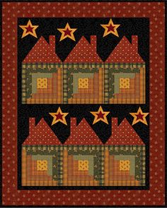 a red and black quilt with stars on the border, in front of a brown background