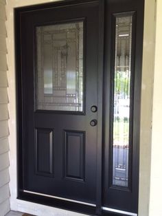 a black double door with glass panels on the front and side doors are shown in this image