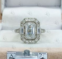 an image of a ring with diamonds on display in a box for sale at a jewelry store