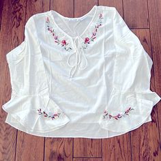 Beautiful Embroidered White Blouse With Angled Sleeves! Great For Home, Vacation , Beach ! Just So Pretty! Slits At Each Side Never Worn, Wrinkled From Package Embroidered V-neck Peasant Top For Beach, Vacation V-neck Blouse With Embroidered Hem, V-neck Blouse With Embroidered Hem For Vacation, Spring Beach Peasant Style Embroidered Top, Peasant Style Embroidered Top For Vacation, Spring Vacation Blouse With Embroidered Hem, Summer Embroidered Blouse With Bell Sleeves, V-neck Vacation Tops With Embroidered Hem, Long Sleeve Blouse With Embroidered Hem For Beach