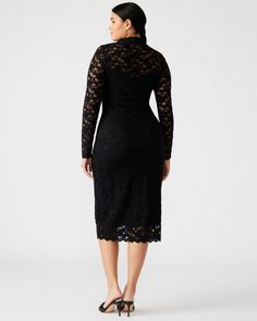 The VIVIENNE dress features a lined midi length sheer mesh outer layer finished with a mock neck and thumbhole sleeves. Long sleeve mock neck midi dress Pullover style Sheer lace mesh fabric over modesty slip with adjustable straps Thumbhole sleeves Length: 46.25" 97% nylon 3% elastane Hand wash Eve is 5ft 9in and is wearing a size small Stephanie is 5ft 10in and is wearing a size large Imported Stretch Lace Dress With Long Sleeves, Knee-length Lace Midi Dress, Knee-length Lace Stretch Midi Dress, Knee-length Stretch Lace Midi Dress, Long Sleeve Stretch Lace Dress With Lace Trim, Fitted Lace Trim Midi Dress For Fall, Stretch Lace Dress With Long Sleeves And Lace Trim, Stretch Lace Knee-length Midi Dress, Stretch Long Sleeve Lace Dress With Lace Trim