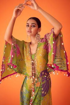 Indian Fusion Cocktail Dress, Festive Luxury Kaftan With Vibrant Print, Luxury Festive Tunic Traditional Wear, Luxury Folk Style Kurta For Festive Season, Luxury Fusion Traditional Wear For Women, Luxury Fusion Traditional Wear For Festive Occasions, Luxury Designer Wear Kurta For Festivals, Luxury Multicolor Embroidered Sets For Festive Occasions, Luxury Short Sleeve Sets For Diwali