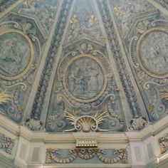 an ornate ceiling with paintings on it