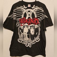 Size Xl Brand New Aerosmith Rock And Roll Band Tee Music Shirt Tour Tee 2009 Black Short Sleeve Tops With Band Logo, Black Short Sleeve Top With Band Logo, Black Band Logo Crew Neck Top, Black Crew Neck Tops With Band Logo, Black Crew Neck Top With Band Logo, Rock Style Logo Print Tops For Concert, Black Band Logo Top For Concert, Black Band Logo Tops For Concert, Black Logo Print Top For Concert