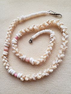 These shells are straight from the hands of the people and beaches  of Niihau, the forbidden island of Hawaii. Niihau shell jewelry is the epitome of elegance for a Hawaiian cultural wedding. Wearing this necklace of off white Niihau Momi shells with pale pink accent stones would be a picture perfect for the bride of Hawaiian descent.  This necklace hangs 26 inches long and is attached with a fine 925 silver clasp. Wearing this lei would accentuate any lovely gown worn for this occasion. Authent Hawaiian Style Wedding, Niihau Shells, Ocean Shells, Cultural Wedding, Hawaiian Necklace, Puka Shell Necklace, Shell Choker, Island Of Hawaii, Puka Shell