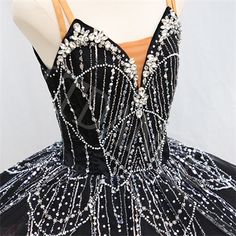 a black and white ball gown with beadings on the bouncy skirt