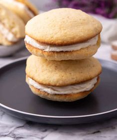 three cookies stacked on top of each other with frosting and icing in the middle