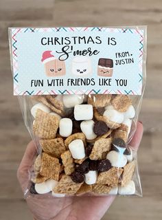 someone is holding up a bag of christmas s'mores with friends like you