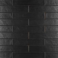 a black brick wall is shown in this image