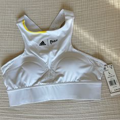 Brand New With Tags. Very Comfortable Straps And Built In Padding. White Sports Bra For Light Summer Sports, White Sports Bra With Light Support For Spring, White Racerback Sports Bra For Summer, White Sports Bra For Light Summer Activities, White Stretch Sports Bra For Summer, Breathable Sports Bra For Spring, White Light Support Sports Bra For Spring, Spring White Running Activewear, White Sports Bra For Summer Training