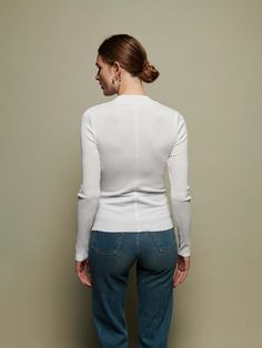 The perfect white, mock neck in our responsible Organic Rib. Use it as a layering piece or wear on it's own. Classic White Fitted Long Sleeve Top, White Fitted Top With Ribbed Cuffs, Fitted Long Sleeve Tops With Ribbed Cuffs, Modern Long Sleeve Tops For Layering, Modern Slim Fit White Tops, Modern Slim Fit White Top, Modern White Slim Fit Tops, Modern White Slim Fit Top, Classic Long Sleeve Tops With Minimal Stretch