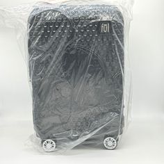 a piece of luggage wrapped in plastic