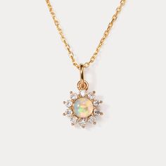 Elevate your everyday style with the timeless beauty of the Selenichast Opal Necklace. Designed for effortless elegance, this stunning necklace features a mesmerizing opal pendant that exudes a captivating play of colors. Its sleek and versatile design makes it the perfect accessory for any occasion, whether it's a casual outing or a formal affair. The high-quality craftsmanship ensures durability and longevity, allowing you to enjoy its beauty day after day. Make a statement with the Selenichas Elegant Opal Clavicle Chain Jewelry, Elegant Opal Round Pendant Jewelry, Elegant Ethiopian Opal Gemstone Necklaces, Elegant Round Opal Pendant Jewelry, Delicate Gold Opal Necklace, Yellow Gold Ethiopian Opal Round Necklace, Yellow Gold Ethiopian Opal Necklace, Elegant Ethiopian Opal Necklace In Yellow Gold, Elegant Round Opal Necklace