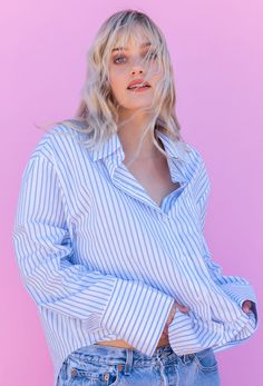 Who doesn't need a crisp white oversized shirt? The CALIstyle Not Your Boyfriends Oversized Shirt features a crisp cotton fabrication with oversized fit, front pocket, extra long sleeves and button cuff. Color: Blue/White Oversized Button Front Extra Long Button Cuff Sleeve 100% Cotton Model Wearing Size Small/Medium and is 32B Bust, 5'7" Tall Oversized Blue Button-up Shirt, Oversized Long Sleeve Shirt For Loungewear, Oversized Collared Shirt For Loungewear, Oversized Button-up Shirt For Daywear, Relaxed Blue Button-up Shirt, Oversized Button-up Shirt For Loungewear, Trendy Relaxed Fit Shirt For Loungewear, Oversized Shirt With Spread Collar For Spring, Relaxed Oversized Button-up Shirt