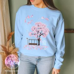 My latest creation is a heartfelt tribute to my all-time favorite song, "Spring Day." This sweatshirt is a visual ode to the emotions and beauty that this song encapsulates. I've poured my heart into crafting a design that captures the essence of "Spring Day." It's a piece of art that reflects the deep lyrics and the emotions it stirs. Comfort is always a priority. That's why I've chosen a top-quality sweatshirt that feels incredibly soft against your skin.  * 50% cotton, 50% polyester * Pre-shr Casual Tops With Custom Artwork For Gift, Casual Tops With Custom Artwork As Gift, Spring Kpop T-shirt With Graphic Print, Kpop Style Graphic Print T-shirt For Spring, Spring Kpop Style T-shirt With Graphic Print, Cute Graphic Print Sweatshirt For Gift, Deep Lyrics, Bts Spring Day, Favorite Song