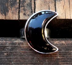 "☾Handmade, Natural Black Onyx Sterling Silver Moon Statement Rings☾ ❤︎Featured in this listing is a sterling silver, handmade, natural stone ring. This lovely ring features a beautiful, Natural Black Onyx Large Moon shaped stone. The Black Onyx Moon has been bezel set into a highly polished, Sterling Silver, sturdy setting. ❤︎Wide gradual band from 4-6mm ❤︎These large 1\" Moons in black onyx have been highly polished, with a rise of 7mm ❤︎Each ring has been hand made, so may vary slightly Stone Unique Black Jewelry With Moon Phase, Unique Black Moon Phase Jewelry, Mystical Black Sterling Silver Rings, Mystical Black Ring As Gift, Black Sterling Silver Moon Phase Jewelry, Celestial Black Sterling Silver Jewelry, Black Sterling Silver Celestial Jewelry, Black Sterling Silver Jewelry With Moon Phase, Black Moon-shaped Jewelry For Gift