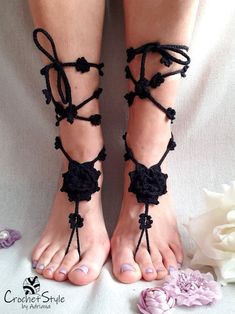 BLACK FLORAL BAREFOOT SANDALS Hand croched, black barefoot sandals with big flower on foot and very decorative flower strings to tie on the leg. Very elegant, eye catching pattern. Made of 100% thickner cotton, stitched with precision in every detail. They are ideal for summer on the beach, yoga as a beautiful decoration on feet. One size fits all. Fabric and care: - 100% classic cotton - hand wash - shape and dry flat to hold the shape - after drying can olso steam flowers on string with an iro Adjustable Black Lace-up Sandals For Vacation, Beach Sandals With Crochet And Round Toe, Beach Crochet Sandals With Round Toe, Crochet Sandals With Round Toe For Beach, Crochet Round Toe Sandals For Beach, Crochet Open Toe Beach Sandals, Crochet Open Toe Sandals For Beach, Crochet Sandals For Beach, Summer Crochet Sandals For The Beach