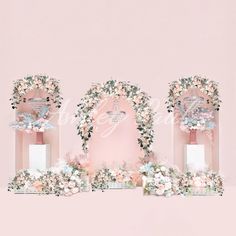 three pink vases with flowers and greenery around them on top of a shelf