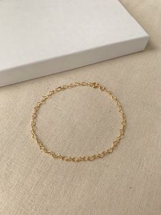 "Hearts are melting for this dainty yet durable mini heart chain bracelet! 💛 This unique chain is sensitive skin and water safe, and is made to live your life in! Wear this minimal piece to brunch, or on a date... this simple heart chain looks lovely anywhere you take it! Details: * 2.8x6mm 14K Gold Filled or 925 Sterling Silver chain * Dainty 14K Gold Filled or 925 Sterling Silver clasp * 14/20 gf stamp for authenticity * Choose your length (each bracelet comes with a .75\" extender chain for Dainty Heart Necklace With Chain For Everyday, Minimalist Heart Bracelet With Adjustable Chain For Everyday, Minimalist Heart Bracelet With Adjustable Chain, Gold Heart Bracelet With Adjustable Chain, Minimalist Everyday Heart Bracelet With Adjustable Chain, Delicate Heart Bracelet With Chain For Everyday Wear, Everyday Gold Heart Bracelet With Adjustable Chain, Dainty Heart Charm Bracelet For Everyday, Delicate Heart Bracelet With Delicate Chain For Everyday