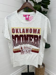 Join the OU Sooners Football craze with our licensed vintage tee in grey. Perfect for game day or any day, this tee exudes professional style. You'll definitely be the "Queen of Sparkles" in this unique and trendy shirt. Grab yours now and show off your team spirit! Ou Sooners Football, Sooners Football, Ou Sooners, Queen Of Sparkles, Professional Style, Oklahoma Sooners, Floral Outfit, Professional Fashion, Trendy Shirts