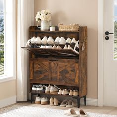 a wooden shoe rack filled with shoes next to a door and window in a room